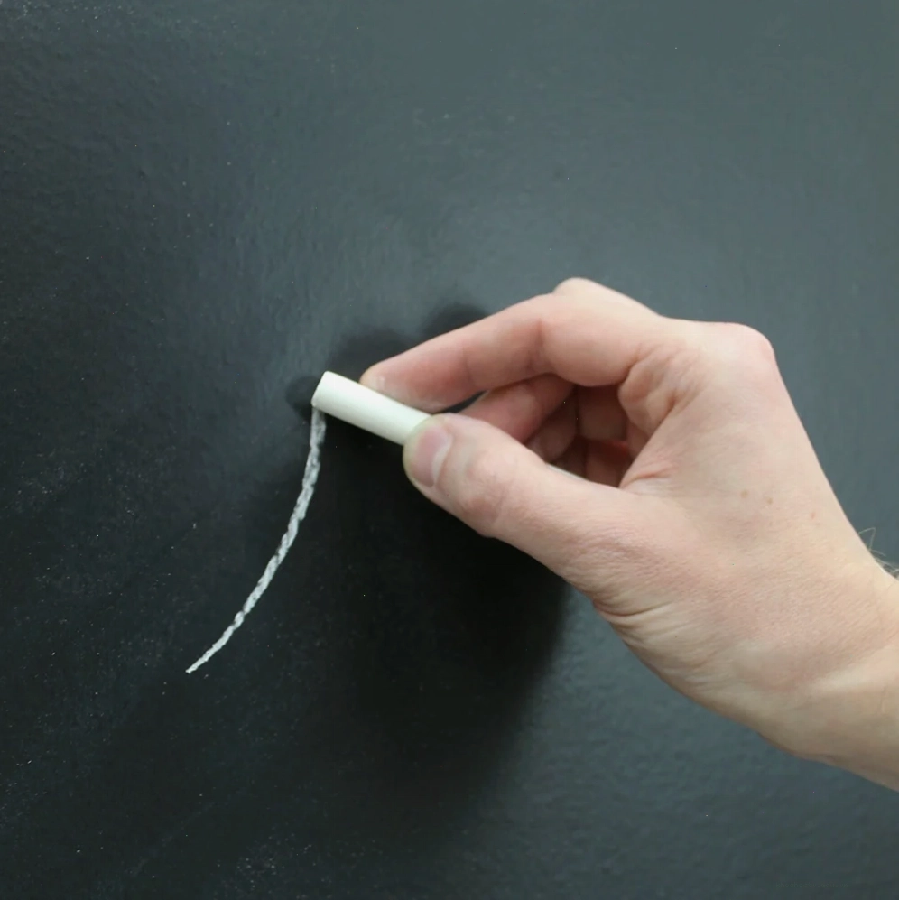 Someone drawing on blackboard wallpaper